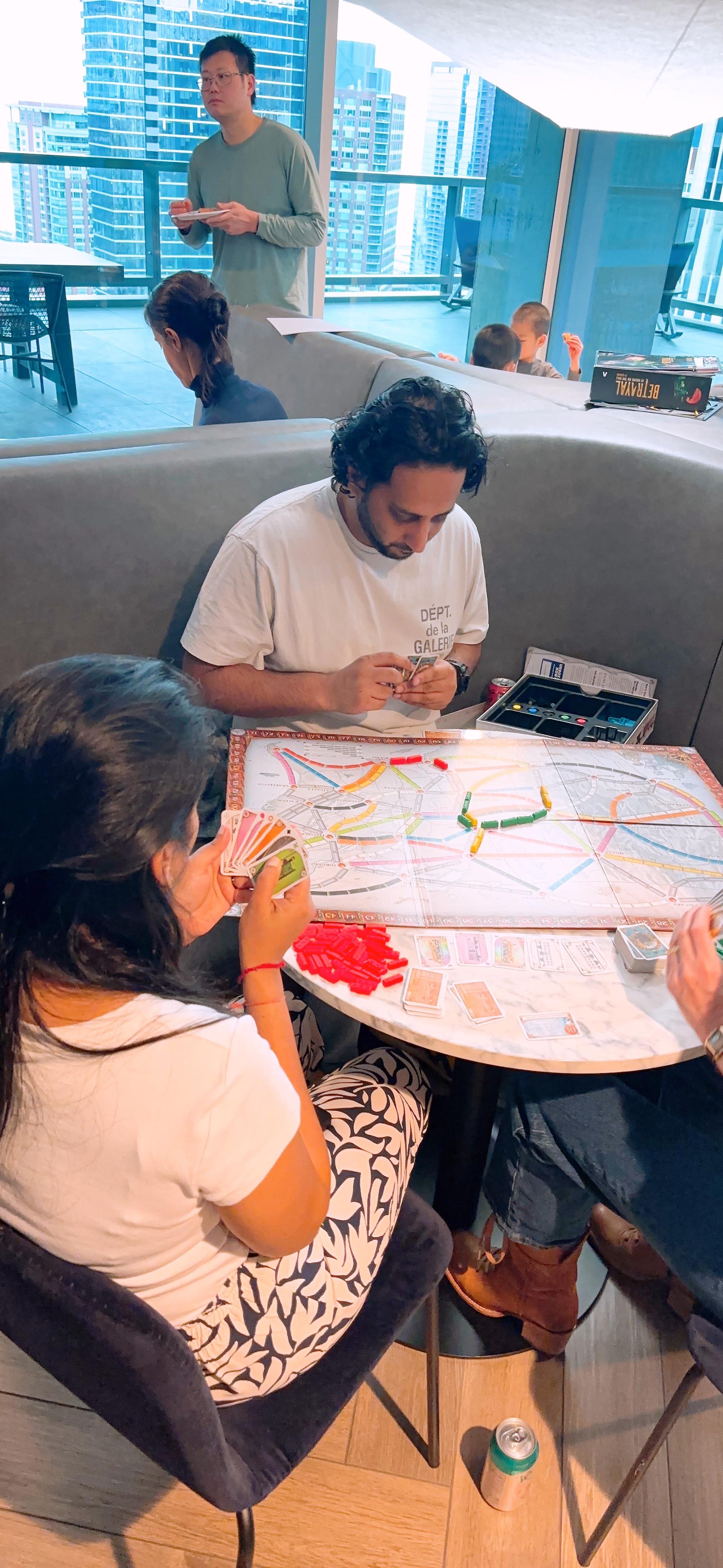 People playing Ticket to Ride